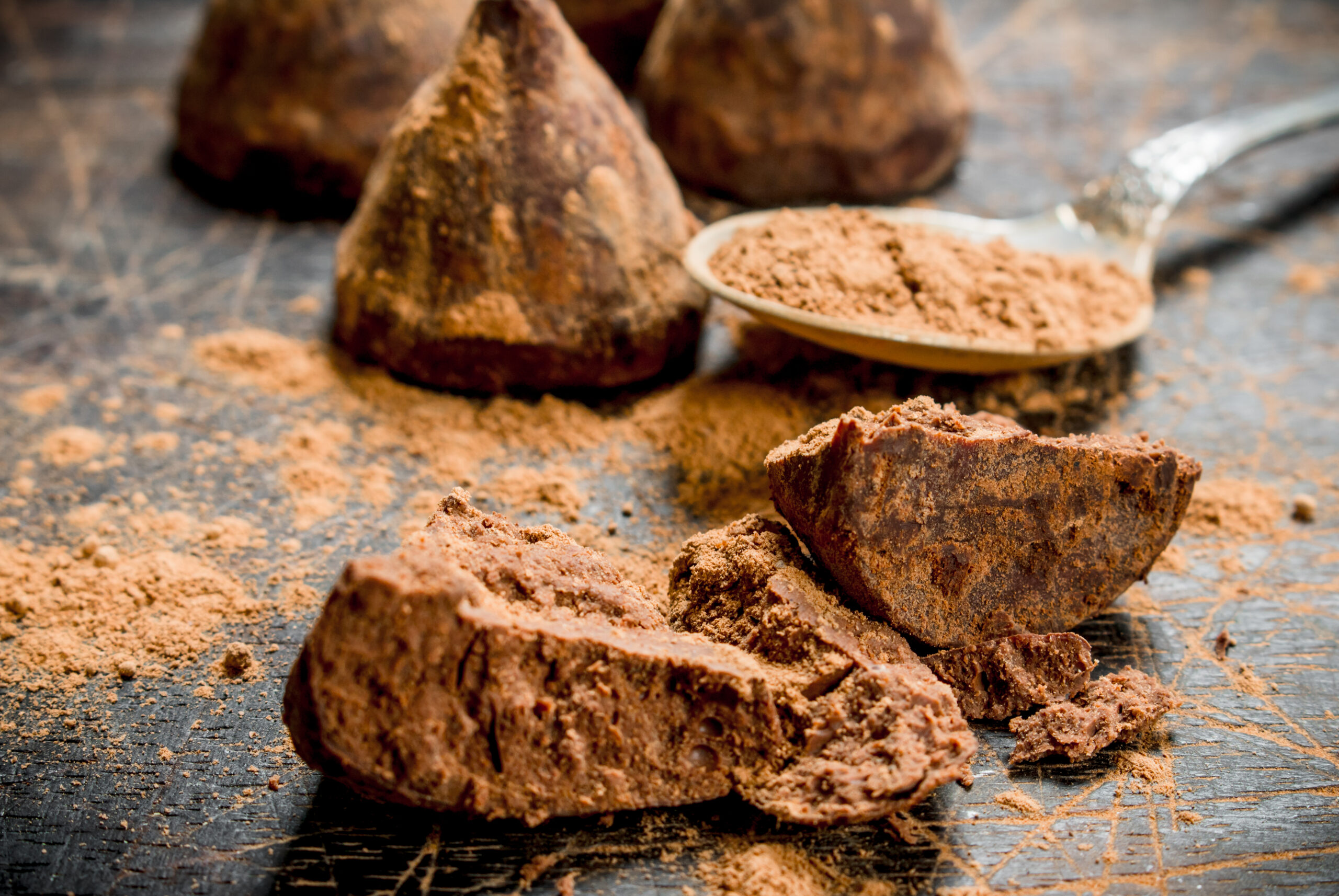 chocolate candy truffles with cocoa powder. on a wooden background.